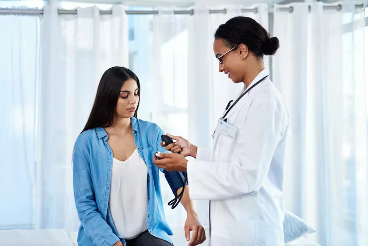 Women Taking a doctor consultation in oxnard , buena medical clinic